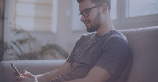 man looking at phone social media